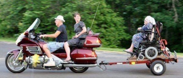 b7c381a6505df42e85983d4fe3804643-old-lady-in-wheel-chair-towed-behind-motorcylce